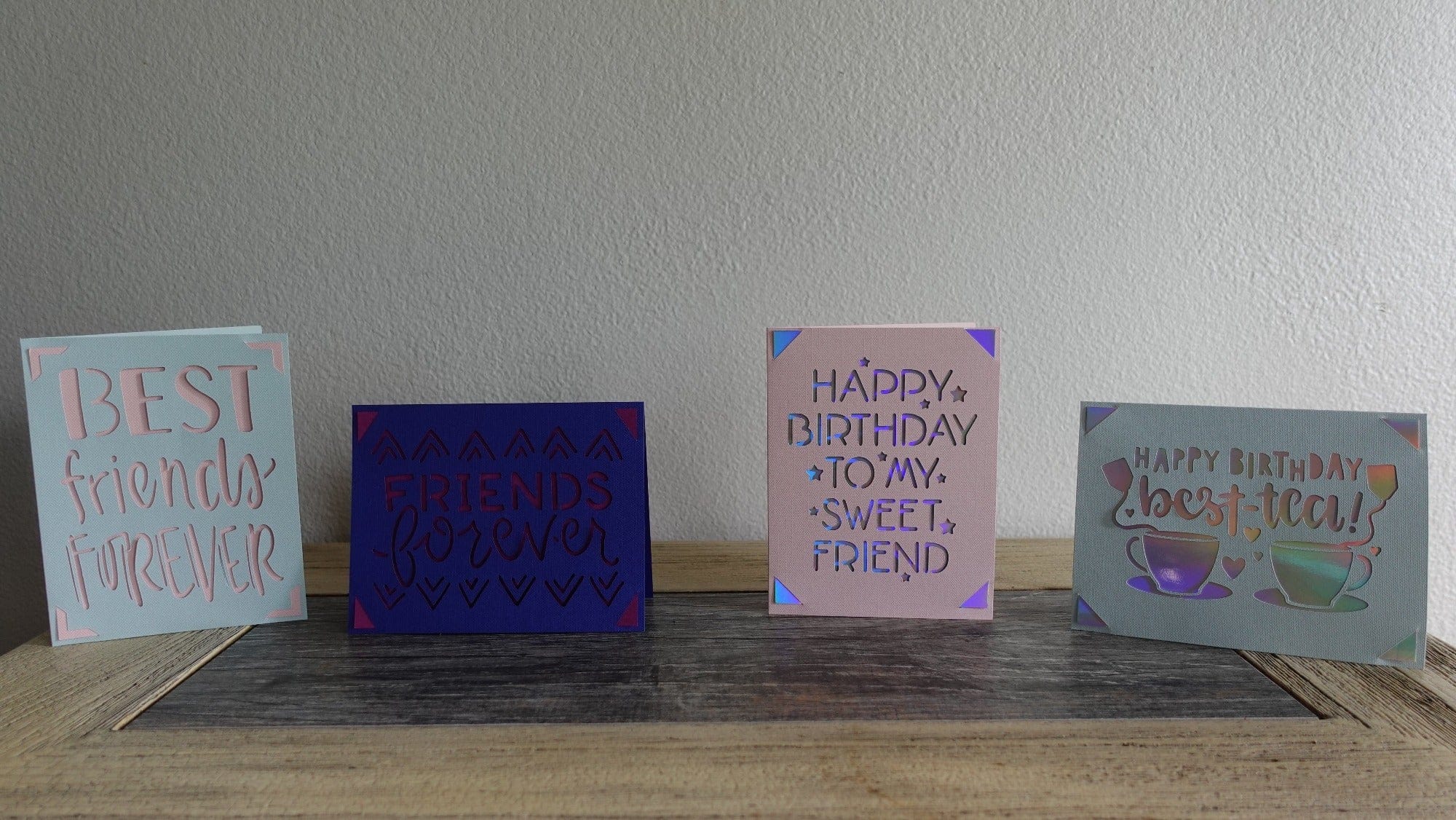 four friends cards on a table