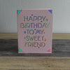 Pink card that says happy birthday to my sweet friend