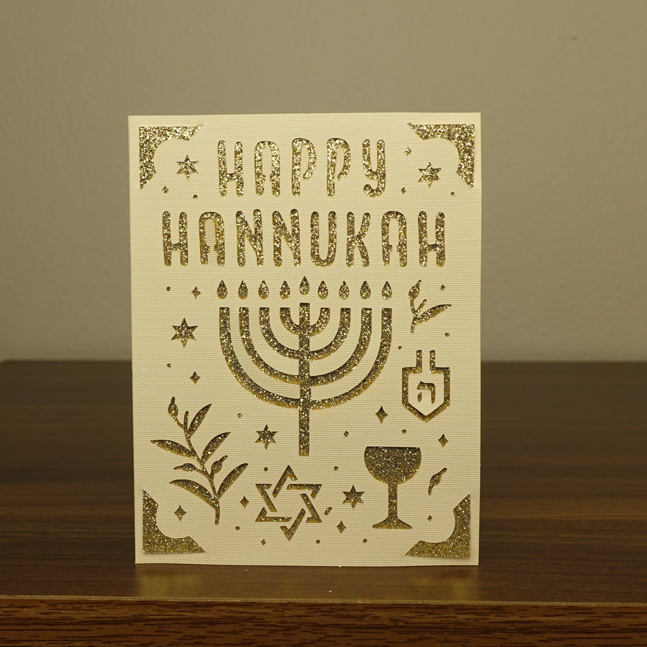 card on table that says happy Hannukah