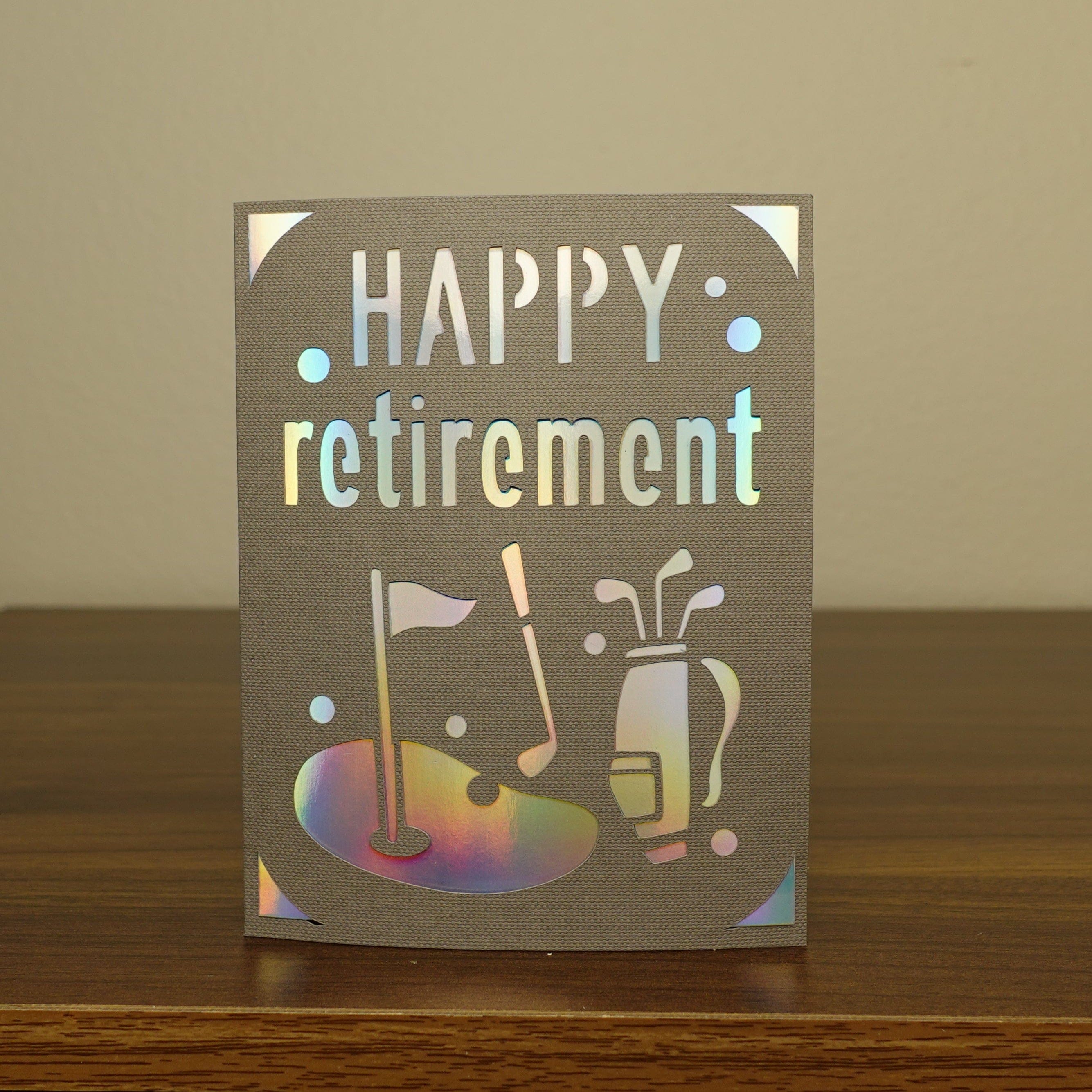 card on table that says happy retirement